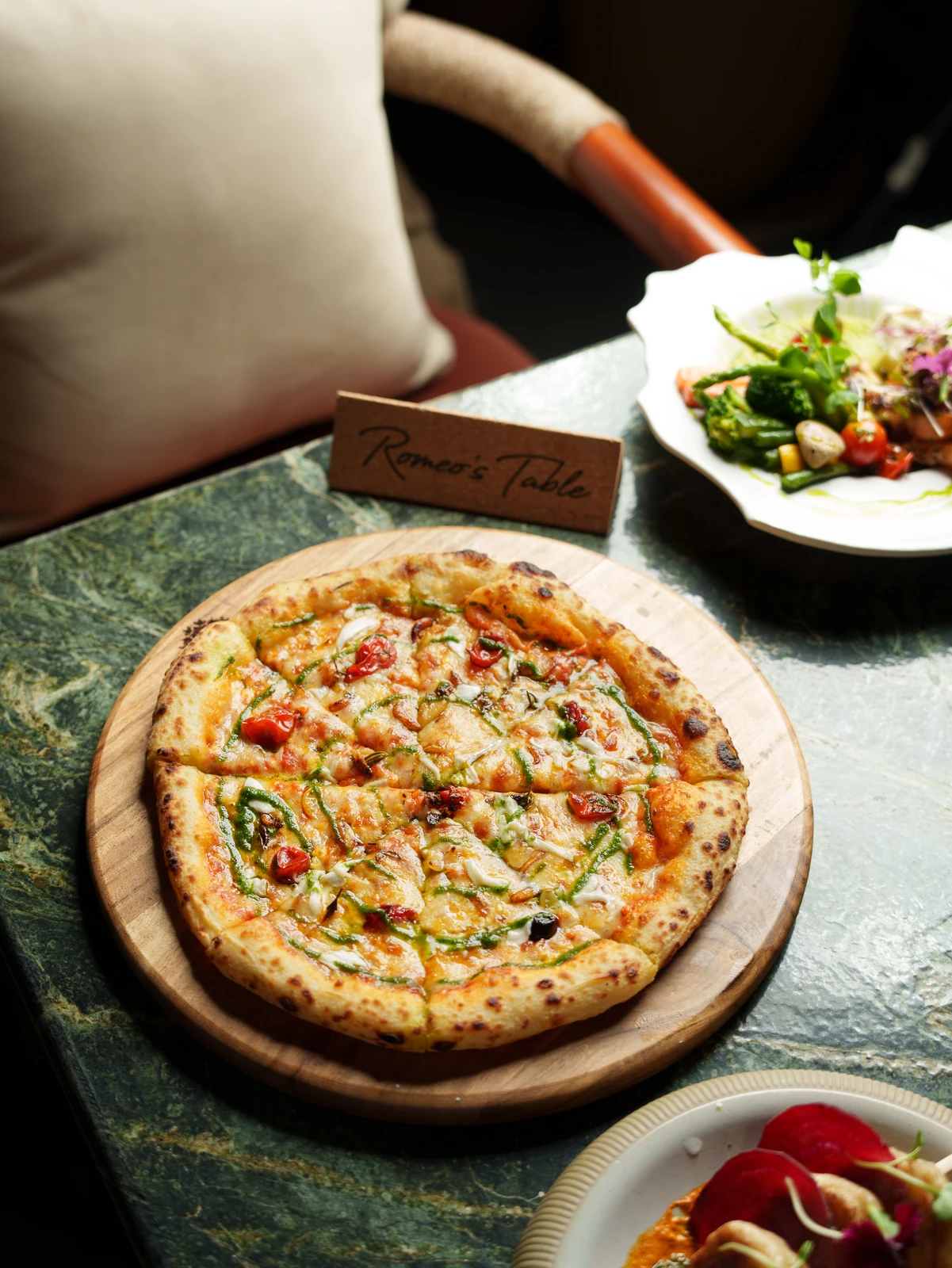 A wood-fired pizza on the marble