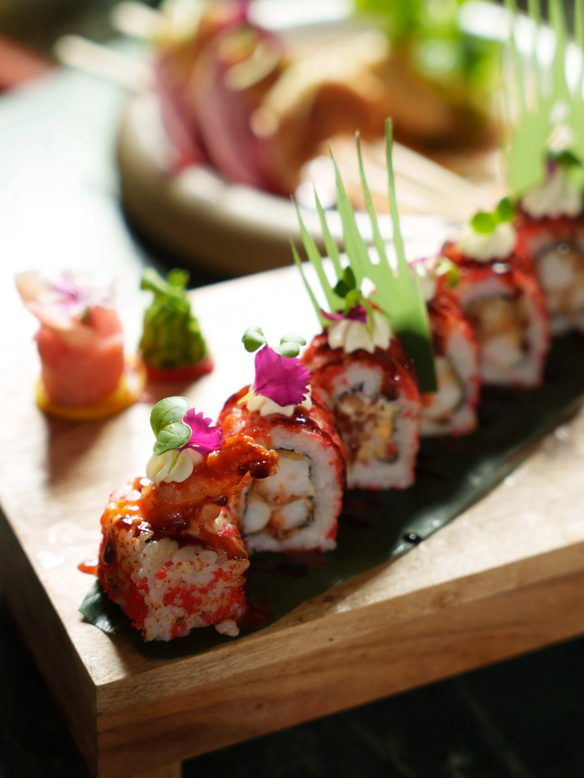 Sushi rolls on a wooden board