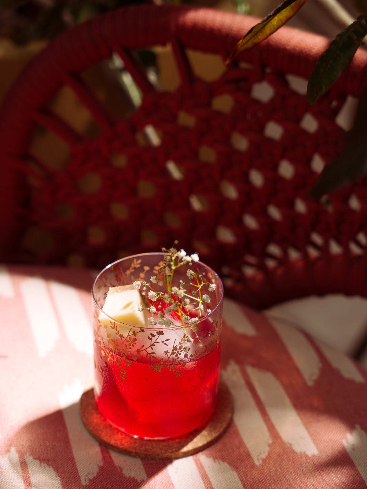 A ruby highball on the ikat cushion
