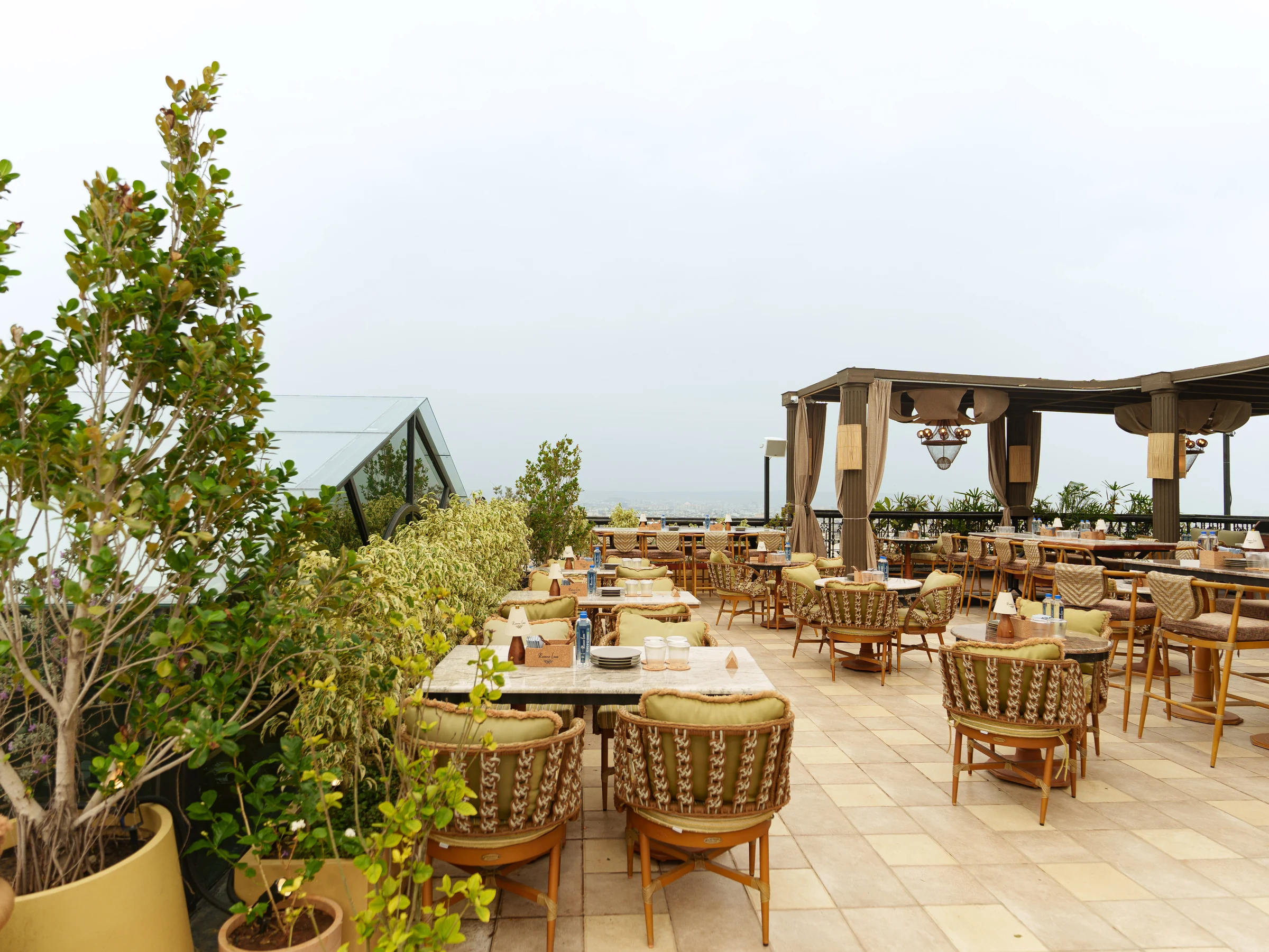 Cane chairs among the terrace plants